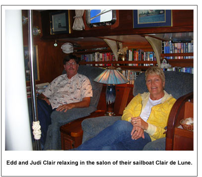 Edd and Judi Clair relaxing in the salon of their sailboat Clair de Lune.