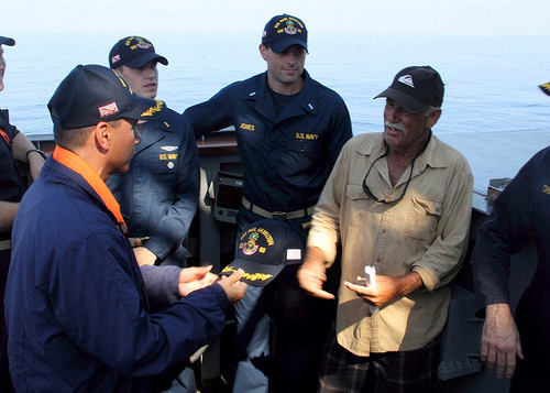 Cmdr. John Barsano, commanding officer of the guided-missile destroyer USS Paul Hamilton (DDG 60),  welcomes Ron Ingraham aboard the Arleigh Burke-class guided-missile destroyer USS Paul Hamilton (DDG 60). Ingraham was stranded at sea without food or water since Nov. 27. A U.S. Coast Guard cutter later responded to tow the vessel back to port.