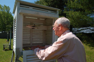 Richard G. Hendrickson taking weather observations at his farm in Bridgehampton, New York. Photo: NOAA
