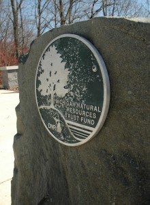 A plaque dedicated to the Michigan Natural Resources Trust Fund stands at Greenview Point Park in Lyons, MI. The park received a $144,700 grant for improvements in 2005.
