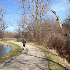 A jogger uses a trail at East Lansings White Park. The park used a $225,000 trust fund grant in 2007 to develop their nature trail, as well as a pavilion and softball field.