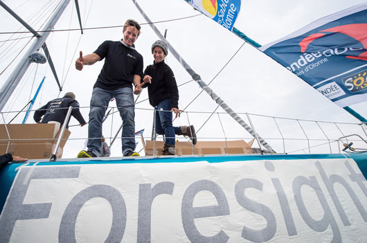100% Natural Energy, Skipper Conrad Colman (NZL), sticking their new sponsor Foresight group, on Vendee Globe pontoons in Les Sables d'Olonne, France, on November 4th, 2016 - Photo Jean-Louis Carli / AFP / DPPI / Vendee Globe