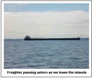 Freighter passing astern as we leave the islands