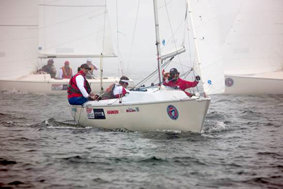 Rick Doerr (far left) with crew Brad Kendell (left), Hugh Freund (right) and Lindsay Smith (background) won in the Sonar class.  Photo credit: Clagett/Thornton Cohen.