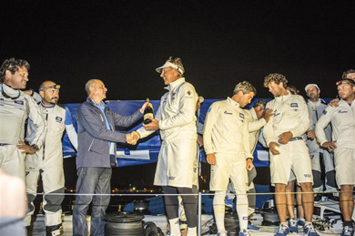 Jochen Schmann, ESIMIT EUROPA 2 (SLO) skipper, and Godwin Zammit, Commodore of the Royal Malta Yacht Club