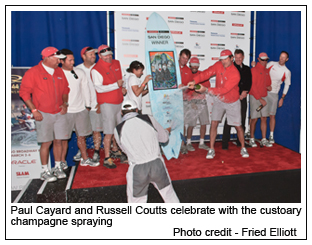 Paul Cayard and Russell Coutts celebrate with the customary champagne
spraying - Photo credit - Fried Elliott