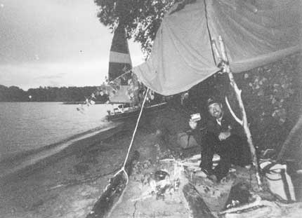 Escaping a thunder storm in one of our hastily built shelters with a hot cup of mocha and a small fire.