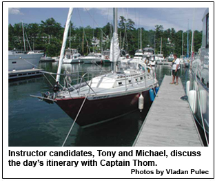 Instructor candidates, Tony and Michael, discuss the days itinerary with Captain Thom