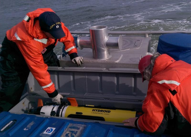 NOAA LT Ryan Wartick and physical scientist Robert Mowery were part of the team who used an AUV to locate five potential targets when searching for a specific wreck.