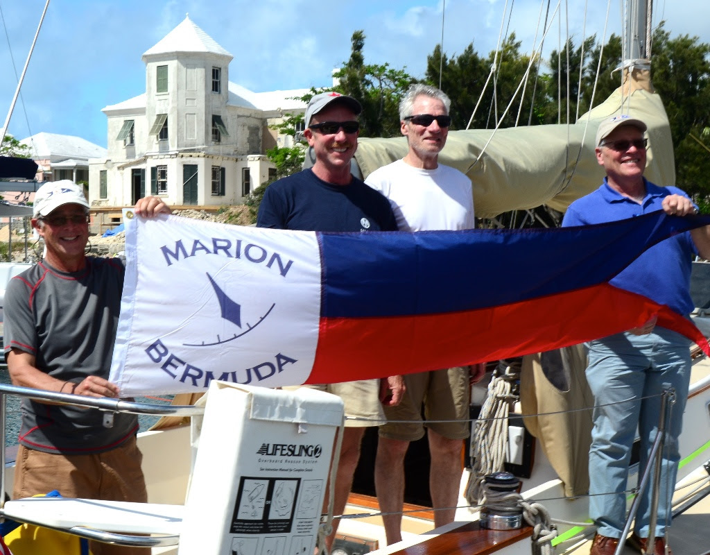 Dave Patton (L) Marion Bermuda Cruising Yacht Race Association  Chairman, and Wilie Forbes Vice Commodore of the Royal Hamilton Amateur Dinghy Club (Far Right) present the Winner's Banner to Chip Brandish (center left) skipper of 'Selkie' and Watch Captain George Dyroff.<br>
'Selkie', Chip Bradish's 1988 Morris Ocean 32.5 footer from Boston was the overall corrected time winner of Class D and the entire 40th Anniversary Marion Bermuda Race. Photo by Talbot Wilson