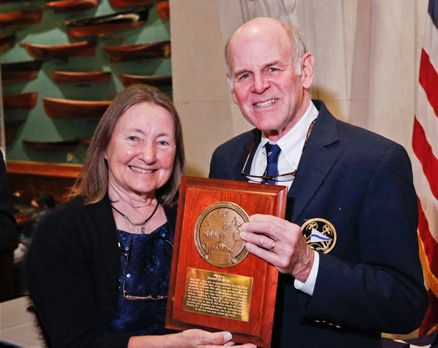 Jeanne Socrates (left) accepts the 2013 Blue Water Medal from Cruising Club of America Commodore Frederic T. Lhamon (right) for her completion of a solo nonstop circumnavigation of the world on her third attempt (Photo Credit CCA/Dan Nerney).